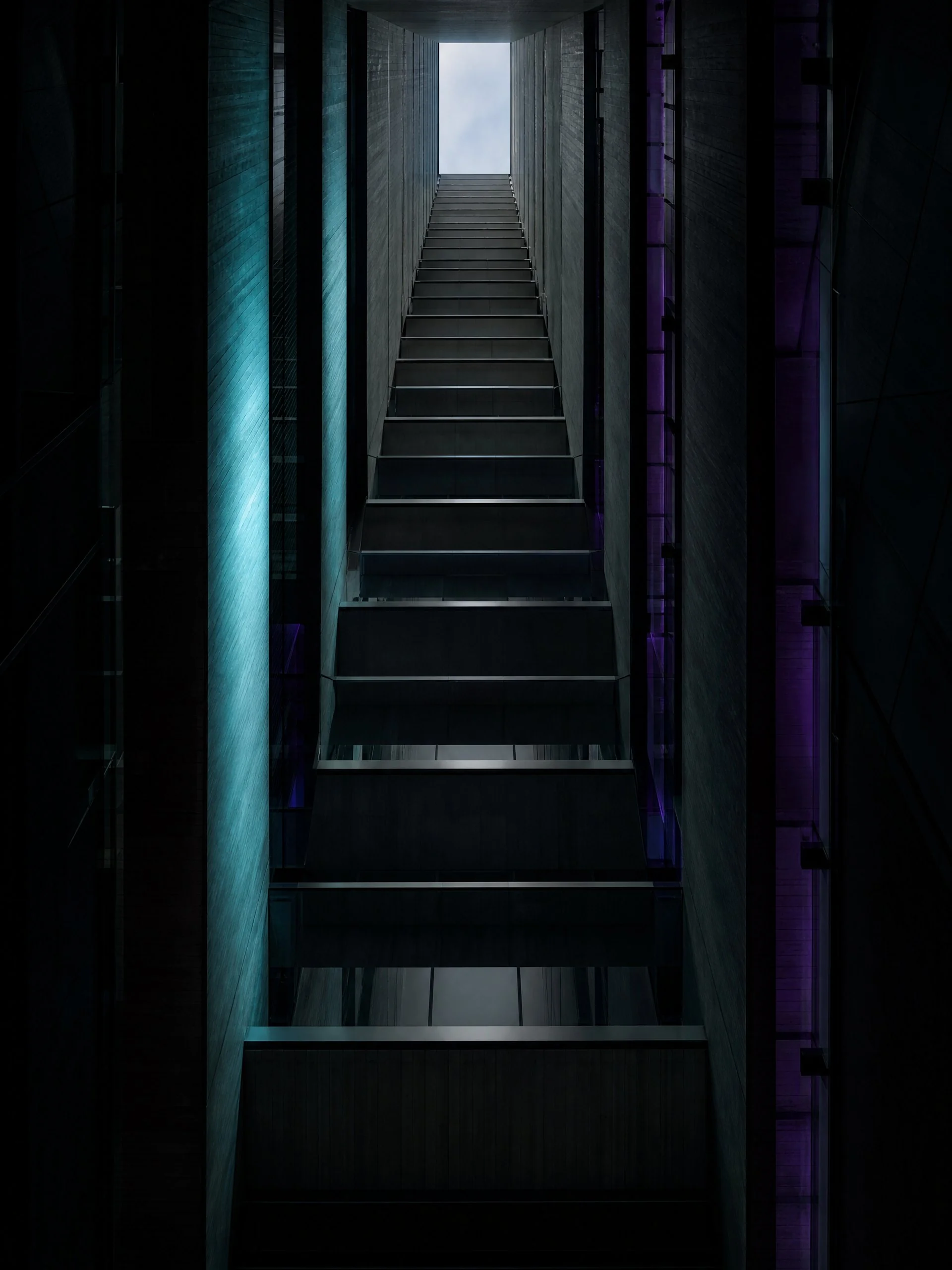 Looking up through the light well of a building to the opening above